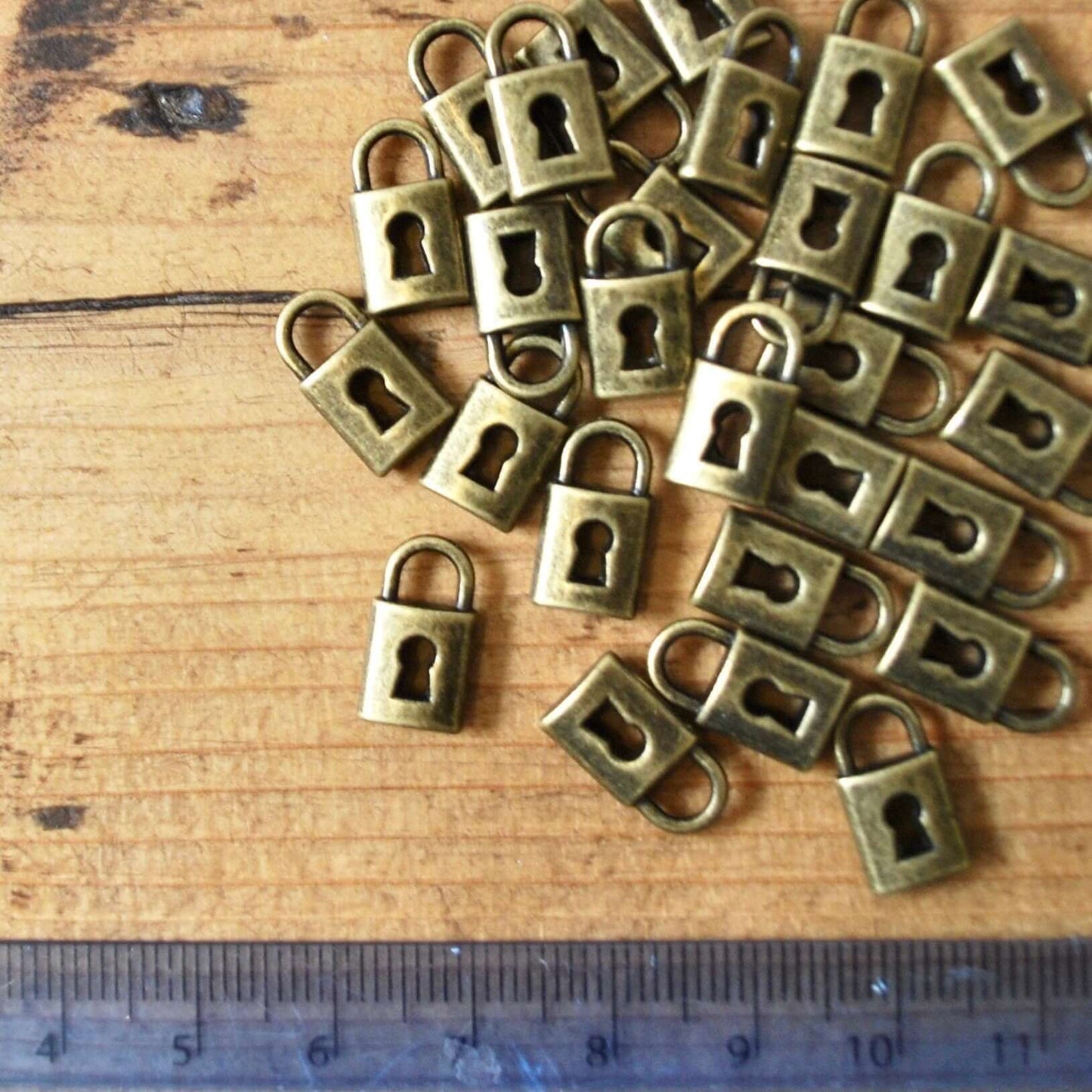 Mini padlock charm 8mm UK Small bronze pendant jewellery fastening - Blacksparrowuk